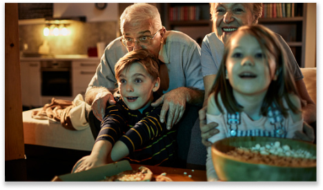 Family watching a movie together